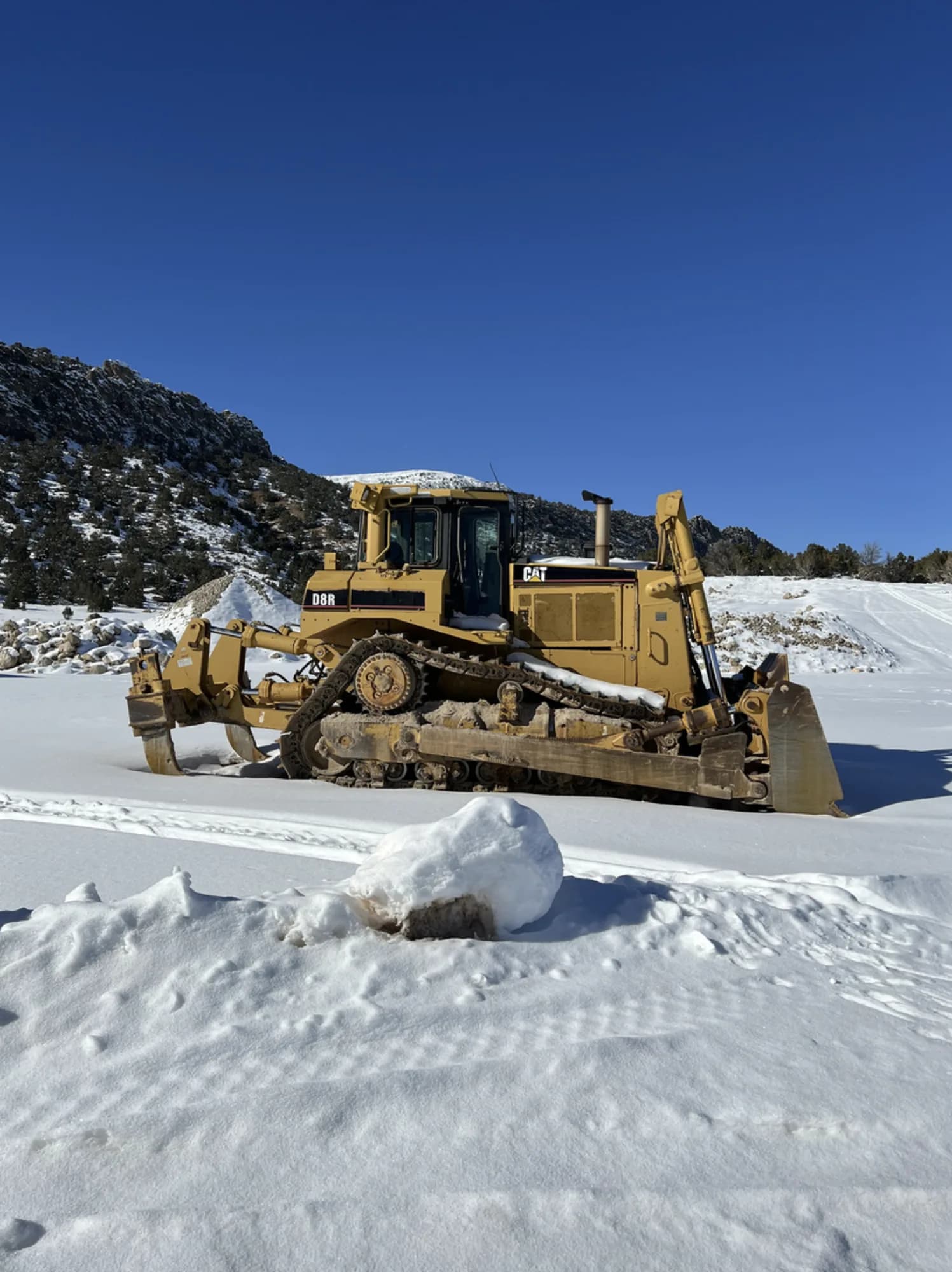 Clawson Excavating CAT D6 dozer operating in winter conditions — all-terrain fleet capability